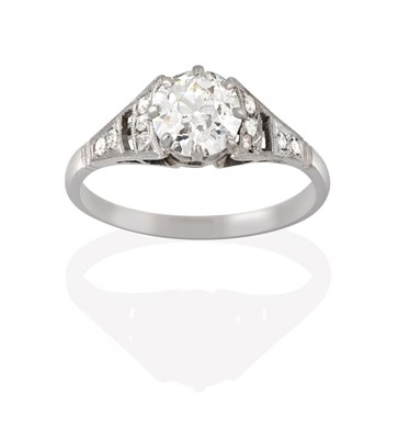 Lot 2196 - A Diamond Solitaire Ring, the old cut diamond in a white claw setting, to openwork eight-cut...