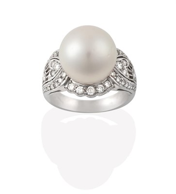 Lot 2200 - A Cultured Pearl and Diamond Ring, the cultured pearl within a round brilliant cut diamond...