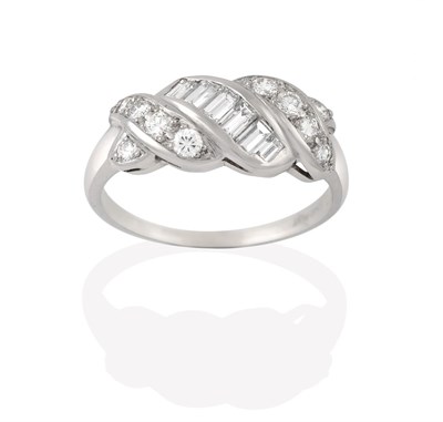 Lot 2205 - A Diamond Ring, a row of graduated baguette cut diamonds flanked by rows of graduated round...