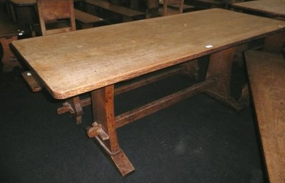 Lot 1712 - A Martin "Lizardman" Dutton Oak 6' Refectory Table, on two shaped end supports joined by a...