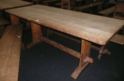 Lot 1717 - A Martin "Lizardman" Dutton Oak 6' Refectory Table, on two shaped end supports joined by a...