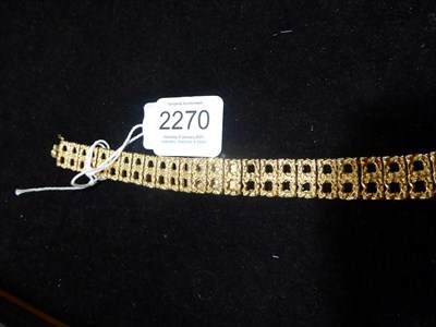 Lot 2270 - A Lady's 14 Carat Gold Wristwatch, signed Geneva, circa 1965, lever movement, champagne...