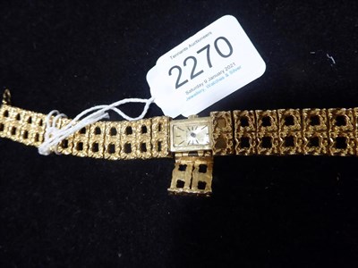 Lot 2270 - A Lady's 14 Carat Gold Wristwatch, signed Geneva, circa 1965, lever movement, champagne...