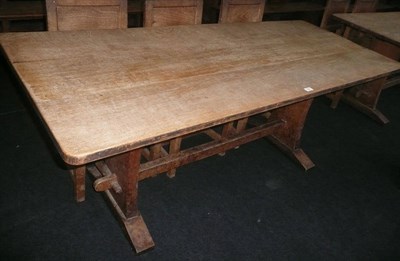 Lot 1721 - A Martin "Lizardman" Dutton Oak 6' Refectory Table, on two shaped end supports joined by a...