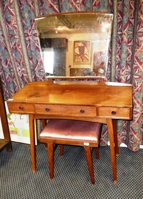 Lot 1726 - A 1950's/60's Cotswold School Walnut Dressing Table, with shaped adjustable mirror above three...