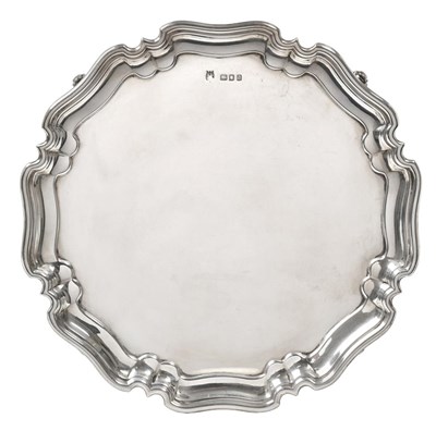 Lot 2353 - A George V Silver Waiter, by Stewart Dawson and Co. Ltd., London, 1919, shaped circular and on four