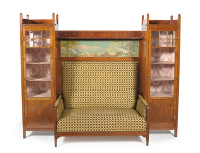 Lot 1727 - A Continental Secessionist Inlaid Mahogany Integral Sofa, enclosed by glazed display cabinets, each