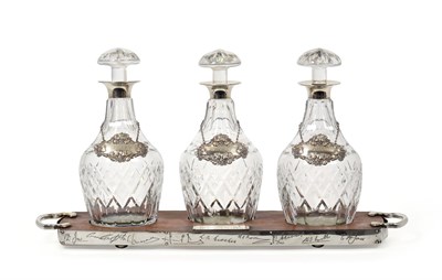 Lot 2368 - An Elizabeth II Silver-Mounted Decanter Stand With Three Cut-Glass Decanters and Wine-Labels,...