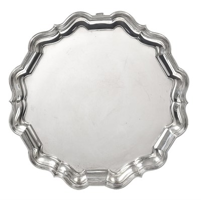 Lot 2377 - A George V Silver Waiter, by Thomas Bradbury and Sons Ltd., Sheffield, 1933, shaped circular and on