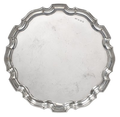 Lot 2379 - A George V Silver Salver, by Deakin and Francis, Birmingham, 1931, shaped circular, 23oz 8dwt,...