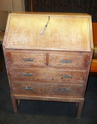 Lot 1731 - An Art Deco Heals Limed Oak Bureau, with sloping fall front over two short over two long...