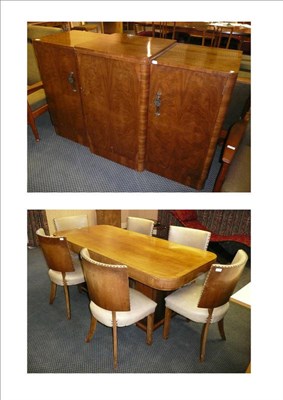 Lot 1732 - An Art Deco Walnut Dining Room Suite, comprising table, six chairs, sideboard and serving...