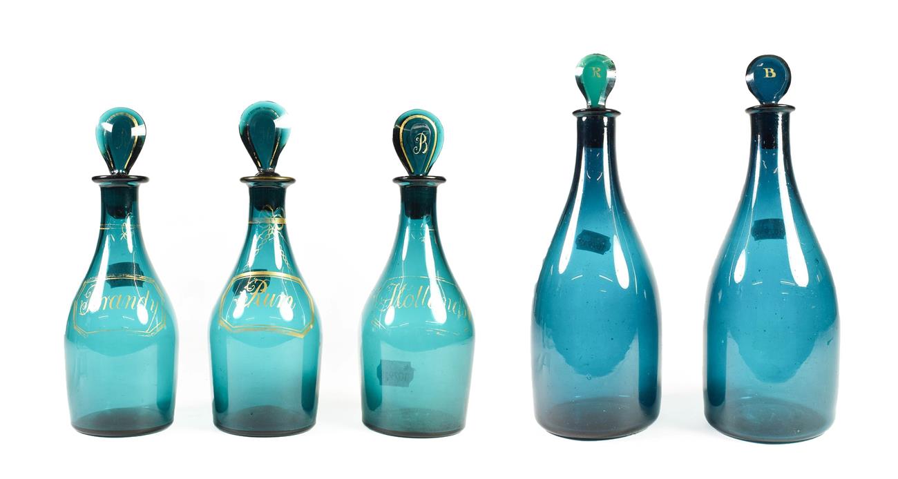 Lot 11 - A Matched Set of Three Green Glass Spirit Decanters and Stoppers, early 19th century, of mallet...