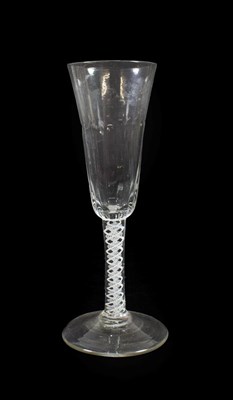 Lot 13 - An Ale Flute, circa 1750, the semi-fluted rounded funnel bowl on an opaque twist stem and...