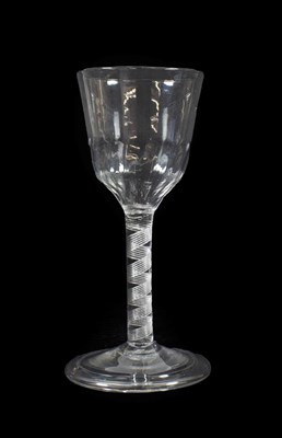 Lot 24 - A Wine Glass, circa 1760, the semi-fluted ogee bowl on an air twist stem and folded foot,...