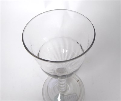Lot 24 - A Wine Glass, circa 1760, the semi-fluted ogee bowl on an air twist stem and folded foot,...