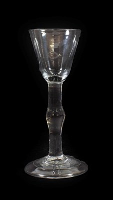 Lot 27 - A Cordial Glass, circa 1760, the rounded funnel bowl on a knopped plain stem and folded foot,...