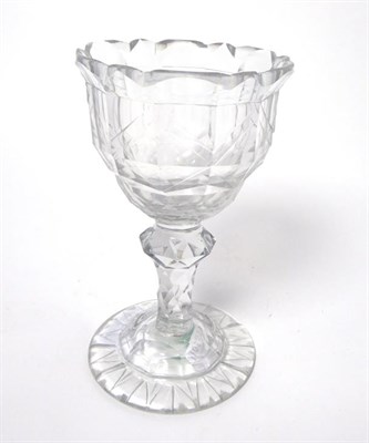 Lot 29 - A Sweetmeat Glass, circa 1790, the ogee bowl with geometric cutting on a faceted knopped stem...