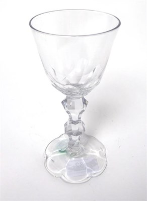 Lot 32 - A Wine Glass, circa 1780, the rounded funnel bowl with basal cutting on a faceted double...
