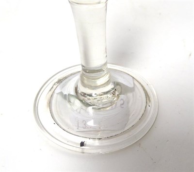 Lot 33 - A ''Gin'' Glass, circa 1760, the bell shaped bowl with basal ball knop on a plain stem and...