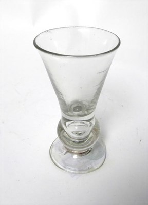 Lot 34 - A Thistle Shaped Dram Glass, circa 1760, the conical bowl on a basal ball knop with air tear...