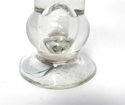 Lot 34 - A Thistle Shaped Dram Glass, circa 1760, the conical bowl on a basal ball knop with air tear...