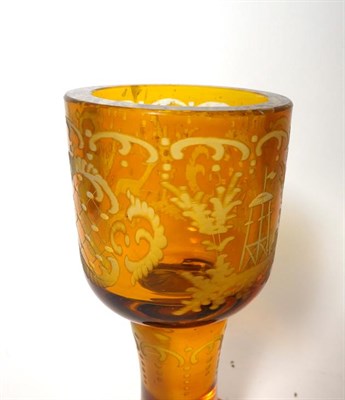 Lot 44 - A Bohemian Amber Overlay Clear Glass Goblet Vase and Cover, mid 19th century, the panelled bowl...