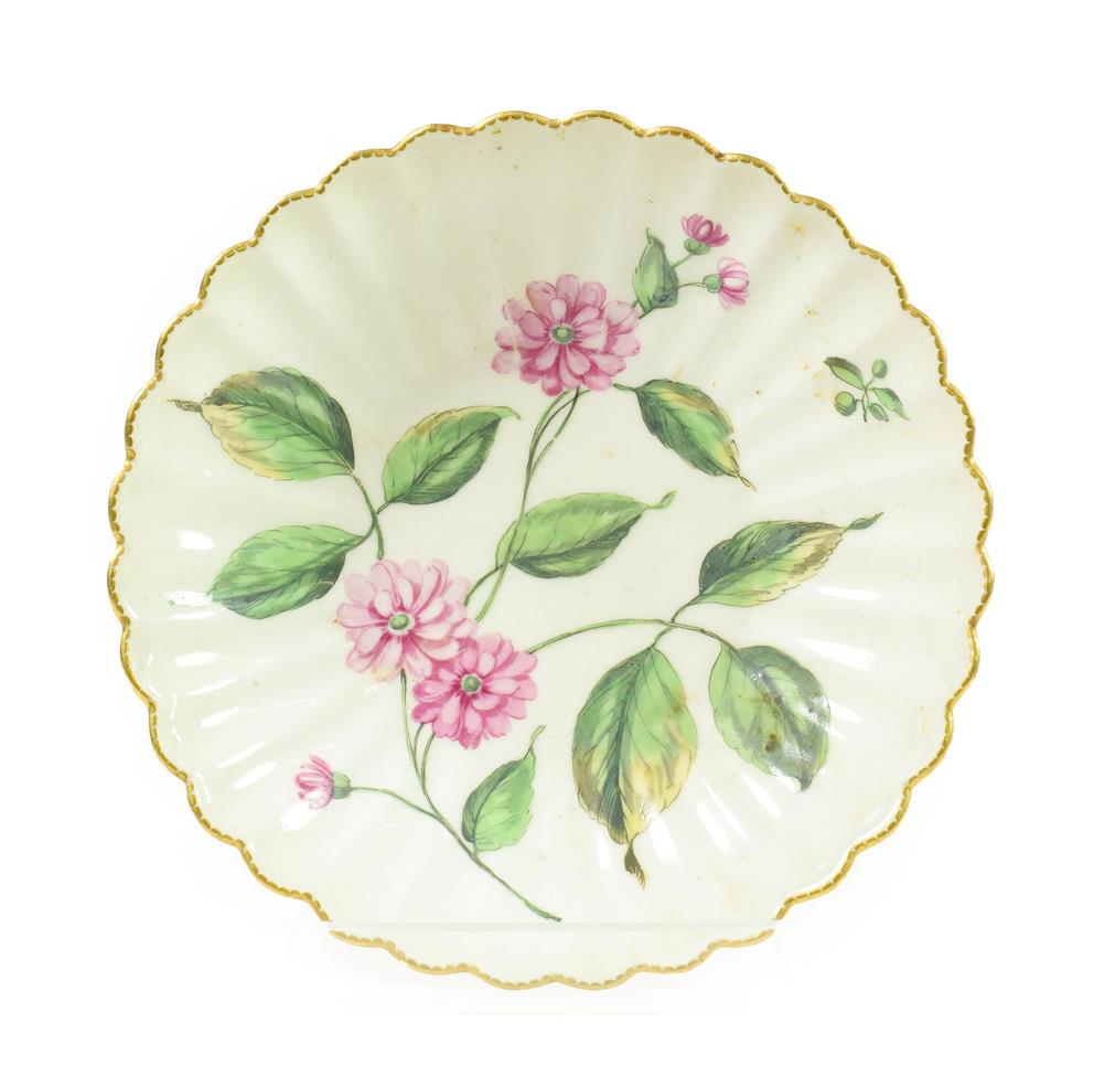 Lot 49 - A Chelsea Porcelain Botanical Fluted Saucer, circa 1755, painted with a sprays of pinks within...