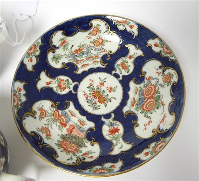 Lot 55 - A Worcester Porcelain Trio, circa 1770, painted with the Queen's Japan pattern on a blue scale...