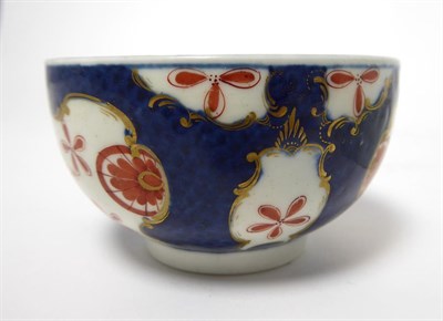 Lot 56 - A Worcester Porcelain Teacup and Saucer, circa 1770, painted with the Queen's Japan Star pattern on