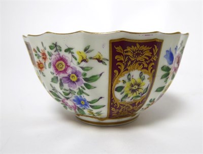 Lot 57 - A Worcester Porcelain Tea Bowl and Saucer, circa 1770, of fluted form, painted with sprays of...
