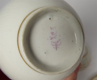Lot 59 - A Derby Porcelain Tea Bowl and Saucer, circa 1790, painted in blue, pink and gilt with a band...