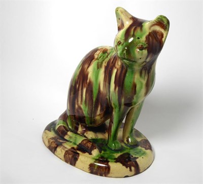 Lot 80 - A Slipware Model of a Seated Cat, possibly Canny Hill Pottery, Bishop Auckland, circa 1860, on...