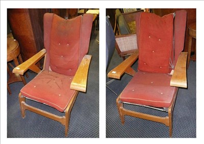 Lot 1742 - A Pair of 1950's Birch Veneered Easy Chairs, upholstered button seat, back and wings, sprung...