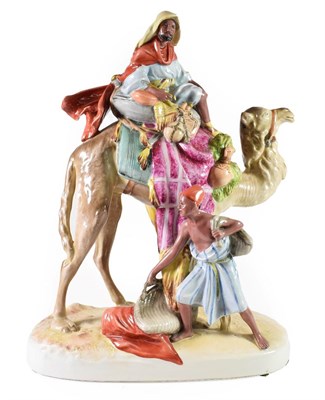 Lot 104 - A Royal Dux Porcelain Figure Group, 1920/30, modelled as an Arab riding a camel, an attendant...