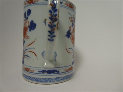 Lot 131 - A Chinese Imari Porcelain Mug, circa 1730, of cylindrical form with strap handle, typically painted