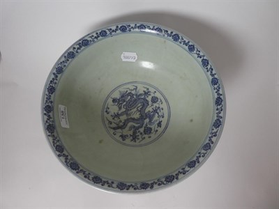 Lot 138 - A Chinese Porcelain Dragon Bowl, Xuande mark but probably late Qing, painted in underglaze blue...