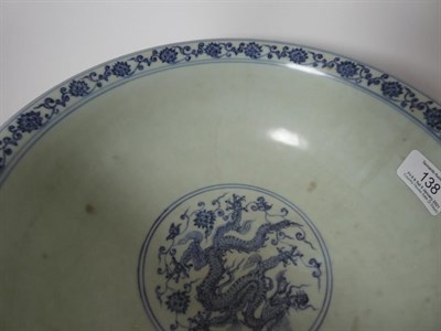 Lot 138 - A Chinese Porcelain Dragon Bowl, Xuande mark but probably late Qing, painted in underglaze blue...