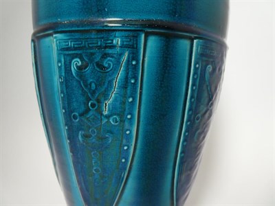 Lot 151 - A Chinese Turquoise Glazed Vase, late Qing, in Archaistic style, of bullet form, moulded with bands