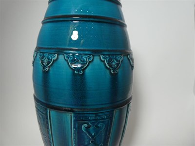 Lot 151 - A Chinese Turquoise Glazed Vase, late Qing, in Archaistic style, of bullet form, moulded with bands