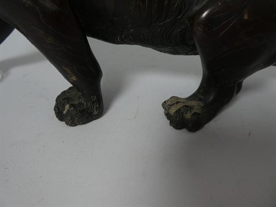 Lot 173 - A Japanese Bronze Figure of a Tiger, Meiji period, naturalistically modelled standing roaring,...