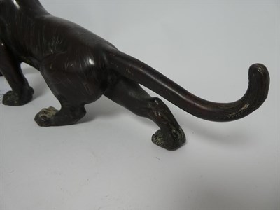 Lot 173 - A Japanese Bronze Figure of a Tiger, Meiji period, naturalistically modelled standing roaring,...