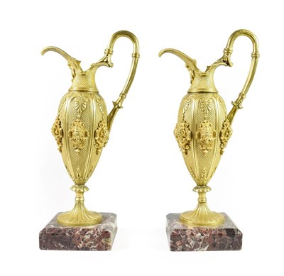 Lot 186 - A Pair of French Gilt Bronze Ewers, mid 19th century, of baluster form with fluted scroll...