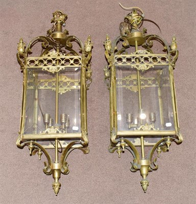 Lot 224 - A Pair of Brass Hanging Lanterns, of square form, with scroll superstructure, fluted finials,...
