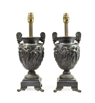 Lot 227 - A Pair of Bronze Table Lamps, late 19th century, as twin-handled classical urns cast with a band of