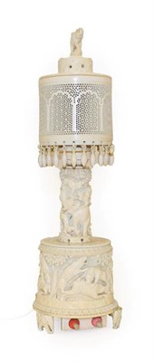 Lot 230 - An Indian Ivory Lamp Base and Shade, 1920-30, with elephant finial, pierced cylindrical shade,...
