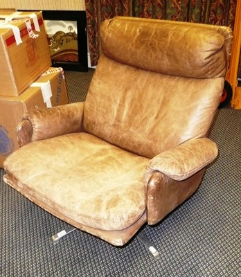 Lot 1756 - A 1960's Brown Leather Swivel Chair, on chrome support, unmarked, 85cm