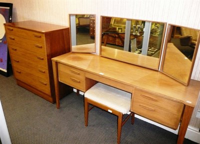 Lot 1757 - A 1960's Walnut Bedroom Suite, by Alfred Cox, comprising dressing table with three tilting...