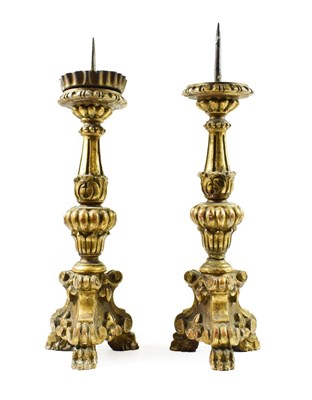 Lot 271 - A Pair of Italian Giltwood and Gesso Pricket Candlesticks, 17th century, of leaf sheathed...