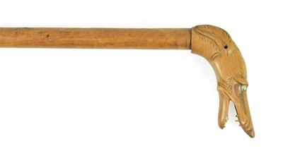 Lot 284 - A Walking Stick, late 19th century, the handle carved as the head of greyhound, with bone teeth and